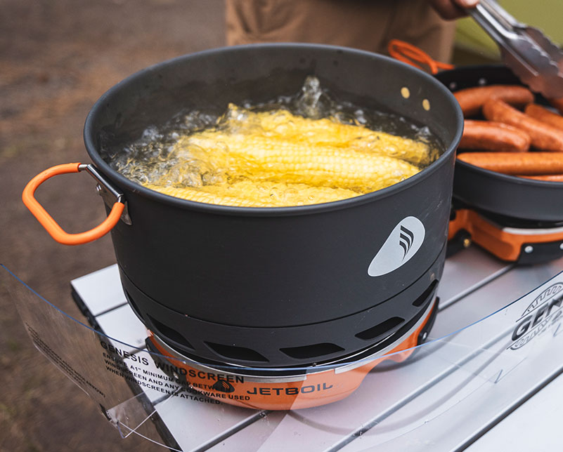 Boiling stalks of corn in the Jetboil 5L Cook Pot on Genesis Basecamp System