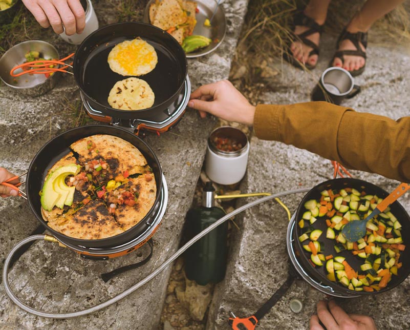 Jetboil HalfGen and Genesis basecamp stoves connected with Jetlink hose