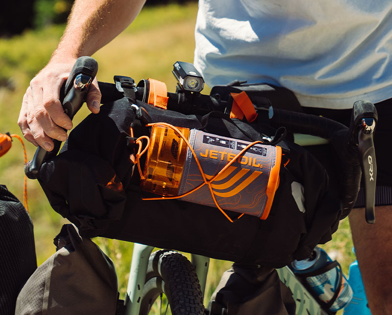 Jetboil Flash Windscreen 1.0L Fast Boil System packed and attached to biker backpack