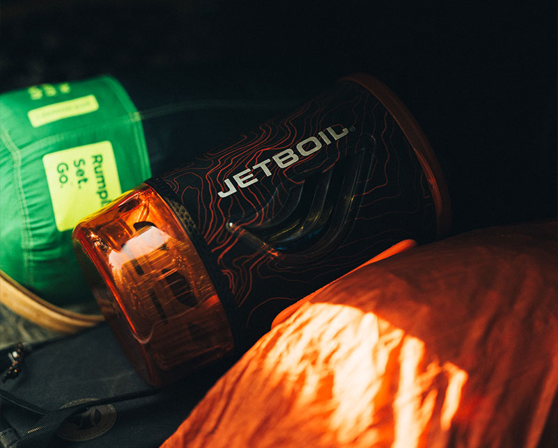 Jetboil Flash java 1.8L fast boil system backed in back with other items