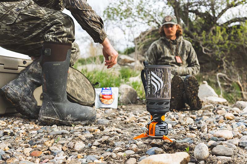 Two men at camp stop on hunting trail waiting for boiling water for meal from the Jetboil Flash 1.0L
