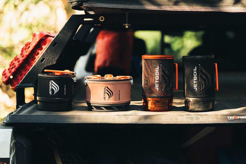 Lineup of various Jetboil backpacking stoves including TrailCook and Flash 1.8L systems
