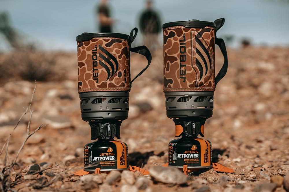 Lineup of the Jetboil Zip 0.8L and Flash 1.0L fast boil systems in the new duck camo colorway