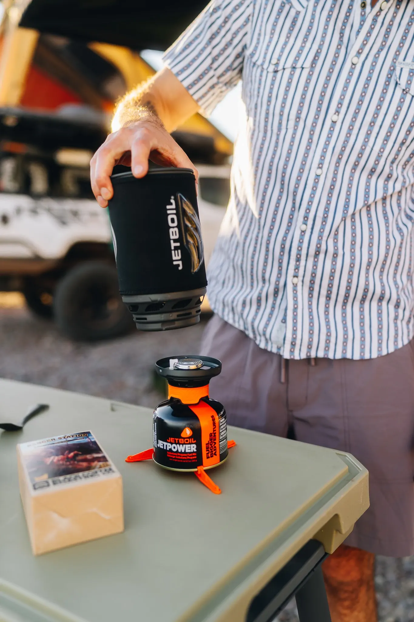 Man setting up Jetboil camping stove