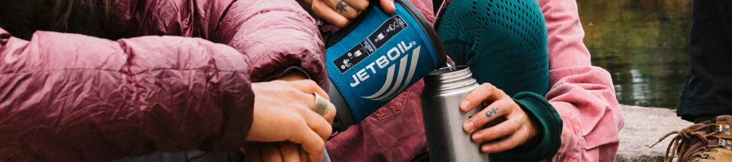 Pouring hot water from Jetboil Matrix Flash Cooking System into steel water bottle