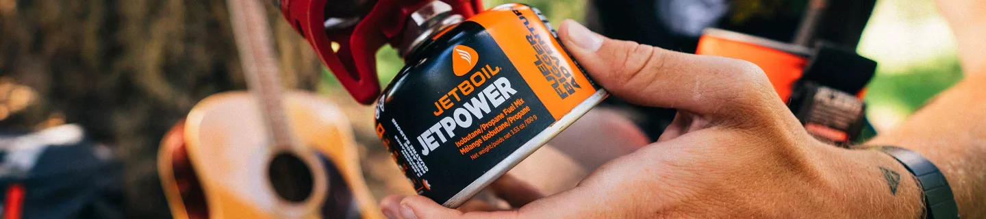 Twisting Jetboil JetPower Fuel Canister in hand into Jetboil Flash Cooking System