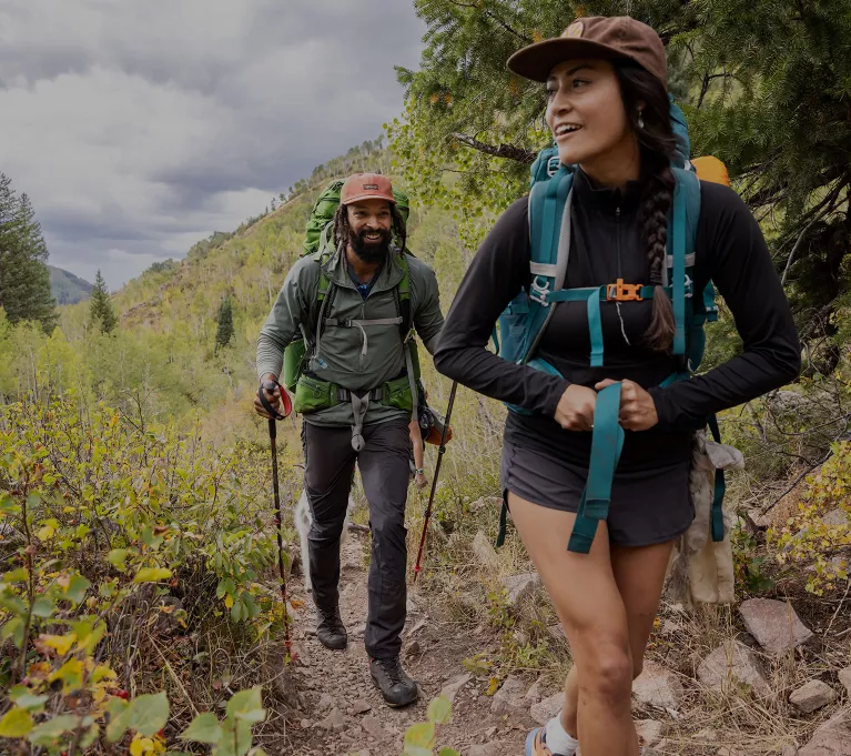 Man and Woman backpacking through Colorado