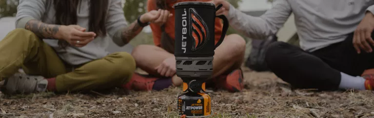 People gathered around the Jetboil Flash 1.0L Fast Boil System