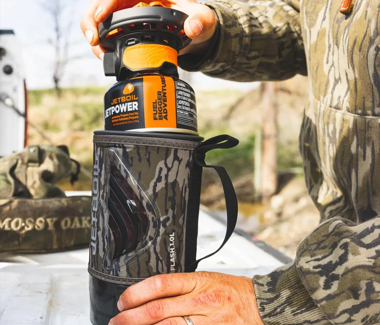 Packing Jetboil Flash 1.0L Fast Boil System burner and JetPower fuel into cooking cup