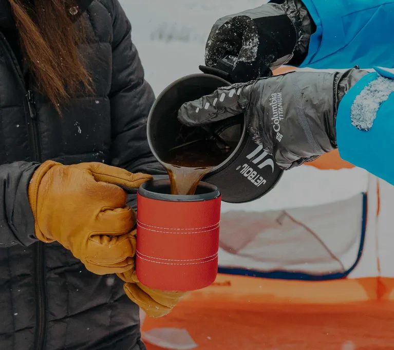 Pouring pressed coffee from the Jetboil SUMO Cooking System