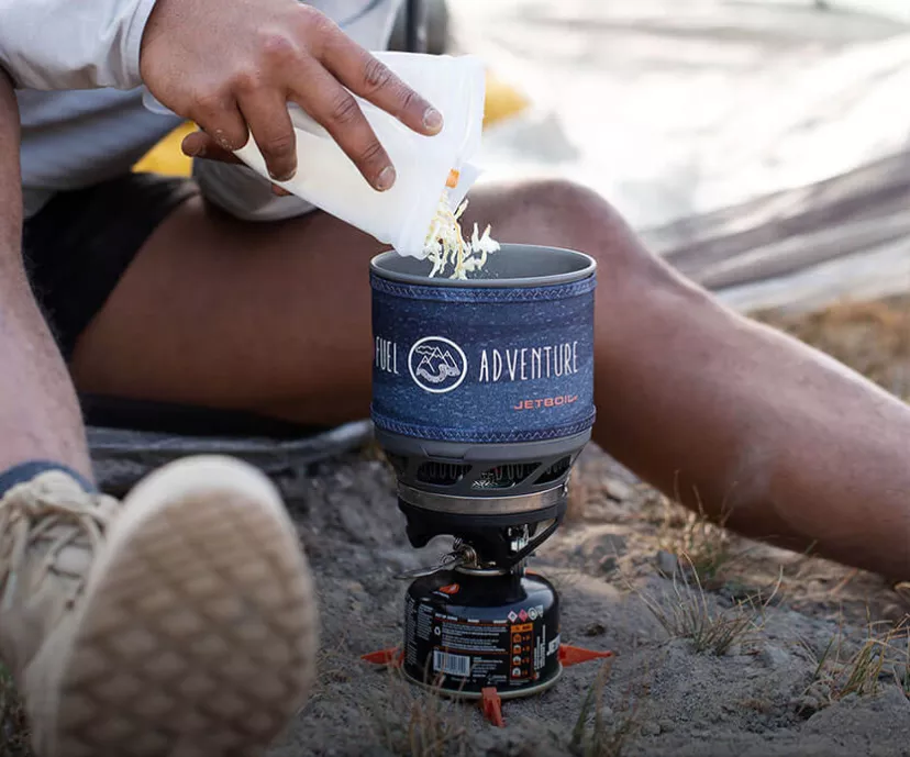 Pouring dry food into Jetboil MiniMo