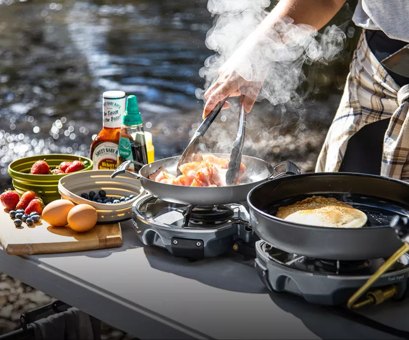 Cooking breakfast of pancakes and bacon in the Jetboil Genesis Basecamp Cooking Stove